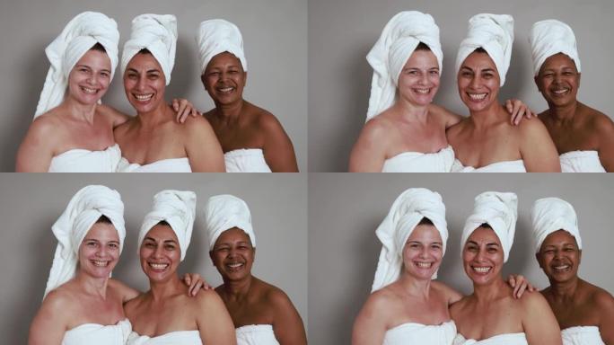 多种族女性在镜头前微笑-不同肤色的成熟人群-美容日和护肤疗法概念