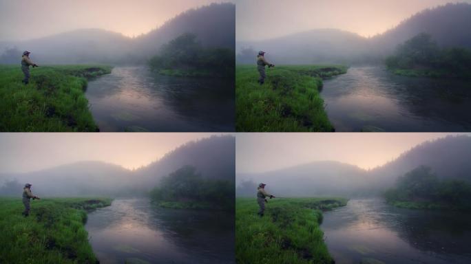 日出时飞钓。业余垂钓者站在河边，在日出时投下苍蝇。苍蝇渔夫在雾蒙蒙的河上铸造和捕鱼