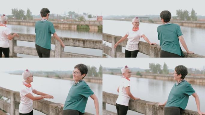 慢跑后，两名活跃的高级妇女走到栏杆上，在河边休息-股票视频。