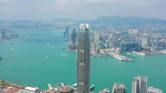 阳光灿烂的香港城市景观市中心著名的威震天维多利亚港空中全景4k