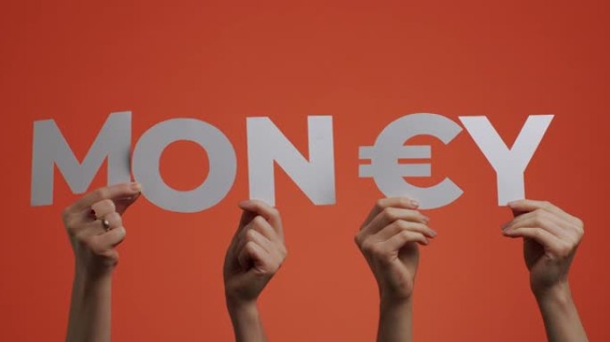 举起手来，用刻纸纸制成的欧元货币标志，用于博客屏幕保护程序，商店