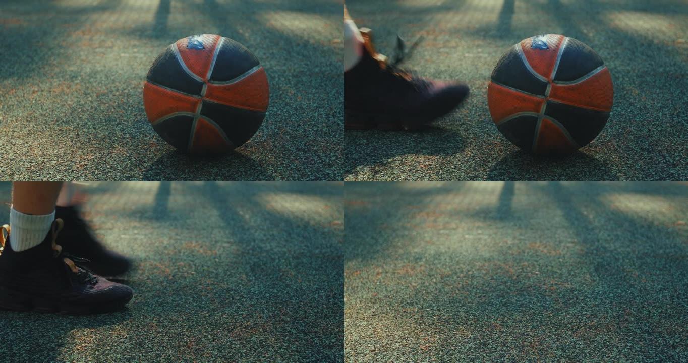 近距离射门，球的焦点放在篮球场上。男性捡起球，然后走开