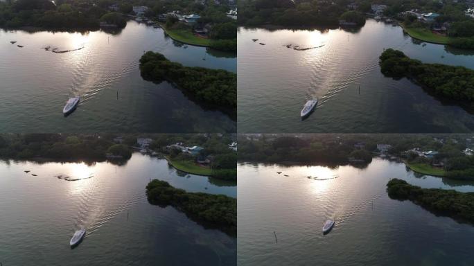 清晨，小型游艇从佛罗里达州萨拉索塔 (Sarasota) 的海岸驶向大海。