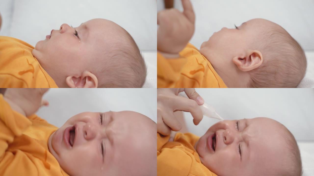 父母使用鼻吸器清除婴儿鼻子上的粘液