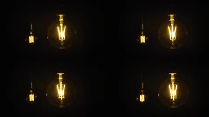 爱迪生灯，老式灯泡在黑暗中发出脉冲光。