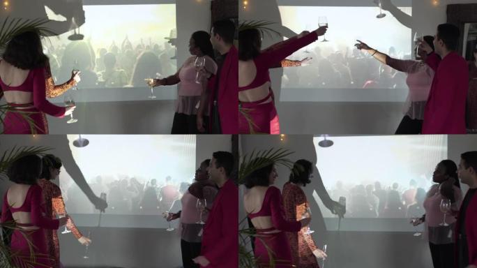 四个人在音乐节投影仪部分虚拟活动中一起跳舞