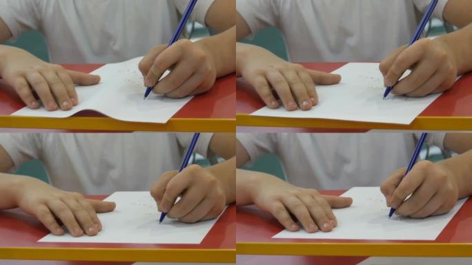 少年少年学习用左手书写