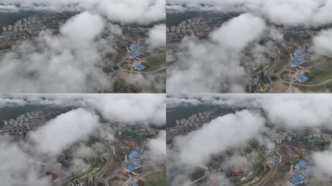 航拍雨后长江城市雨雾