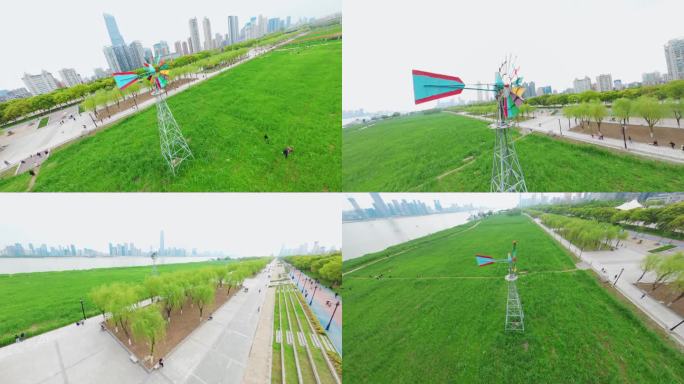 武汉汉口江滩芦苇彩色风车转动穿越机航拍