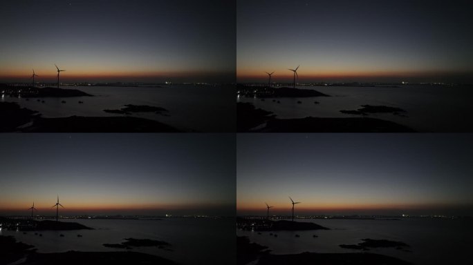 夜晚海边风车航拍大海夜景自然风光晚上风景