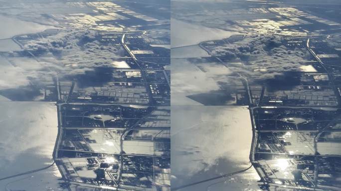 飞机AI上拍摄地面云海和河流城市
