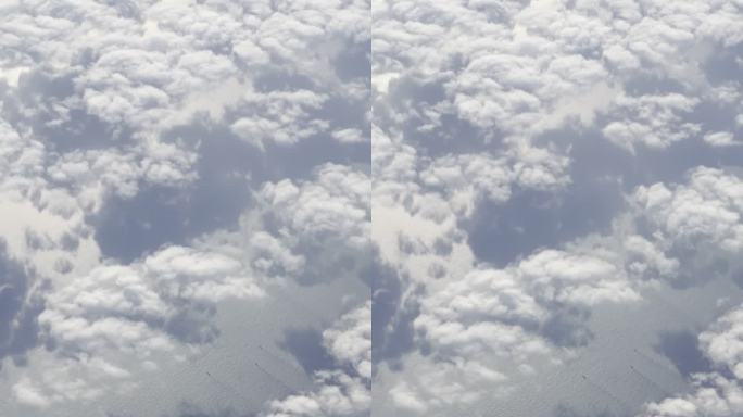 飞机上拍摄地面云海和河流城市