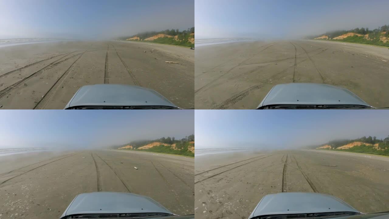 在沙滩汽车引擎盖上的海洋薄雾中驾驶