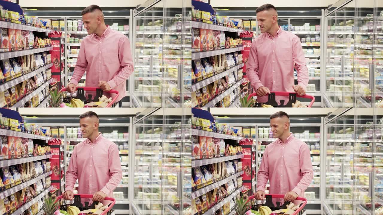 英俊的中年男子在超市购买食品杂货 -- 静态相机