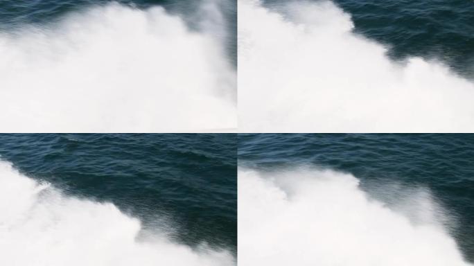 海浪从帆船上溅起。