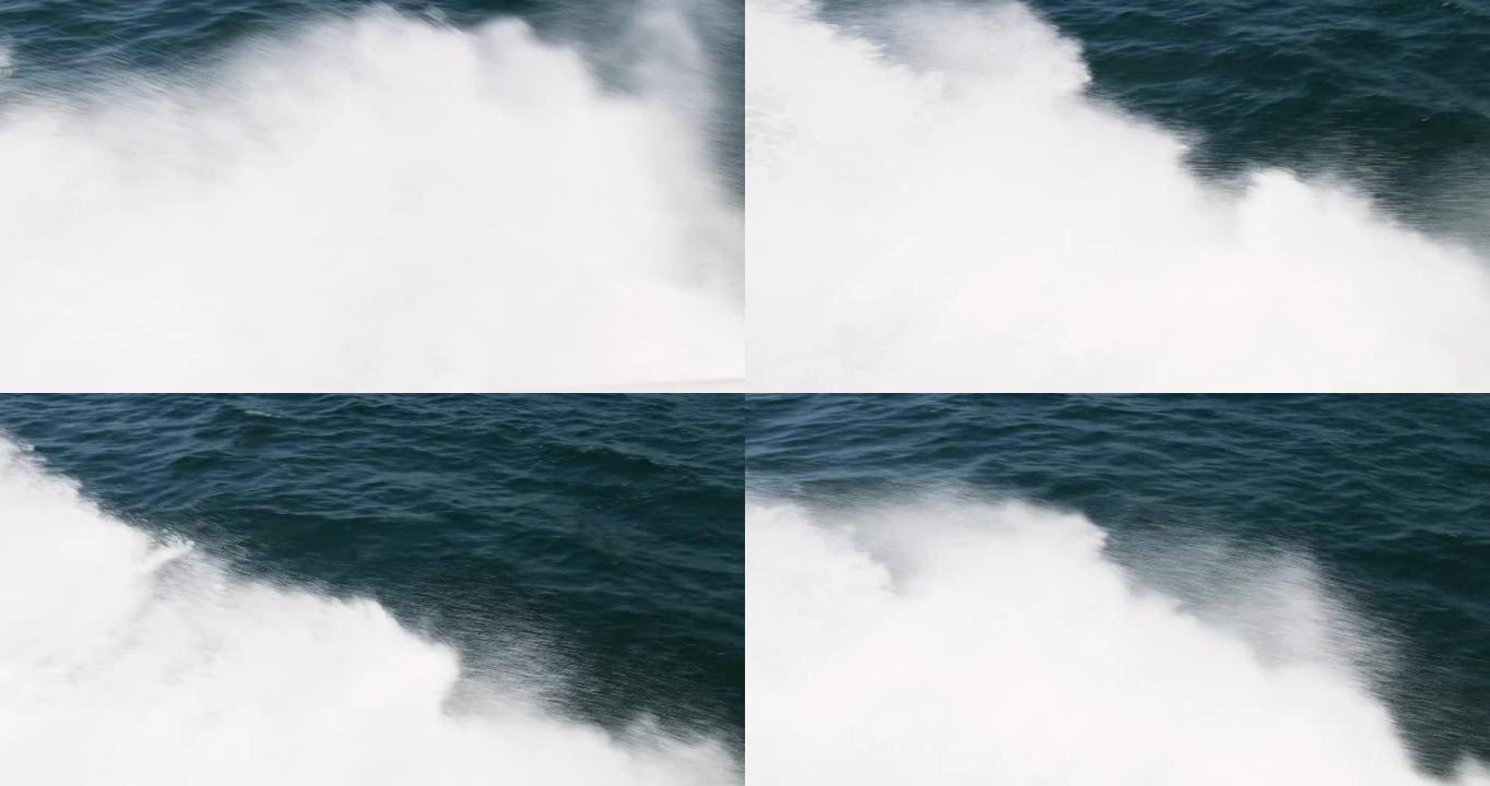 海浪从帆船上溅起。