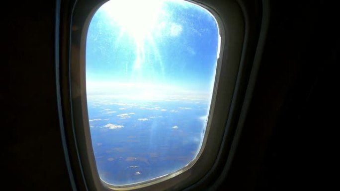 太阳和地球穿过飞机的窗户