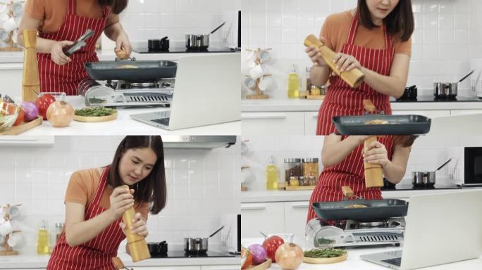 亚洲女性学习如何从互联网上做饭