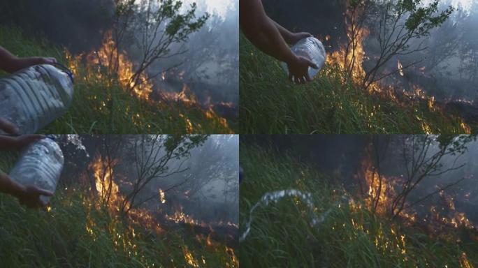 志愿者男子或男孩扑灭野火。从塑料瓶里倒水。雨林野火灾害，干灌木丛燃烧，火灾原因。