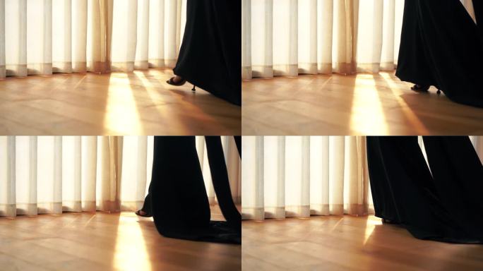 房间室内女人穿黑色裙子高跟鞋走路黑色长裙