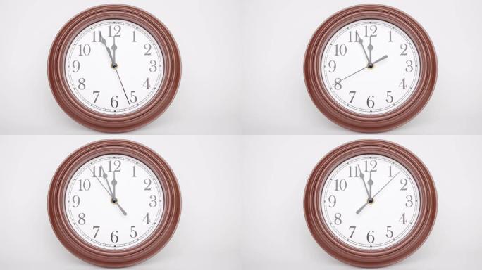 经典风格的手表，棕色外壳孤立在白色背景下，播放时间上午11点55分或晚上。
