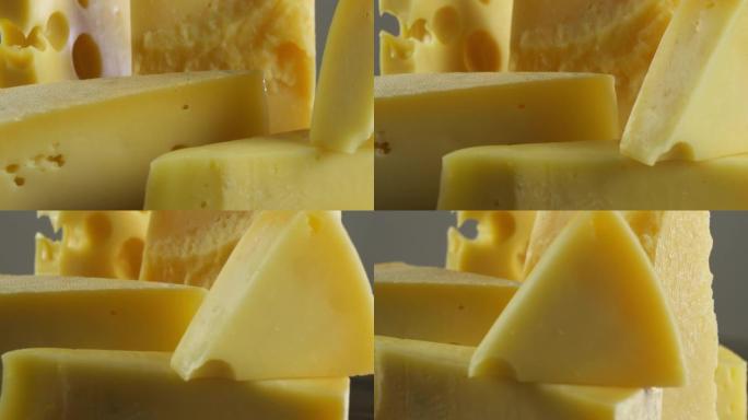 多种不同类型的奶酪，奶酪背景旋转缓慢