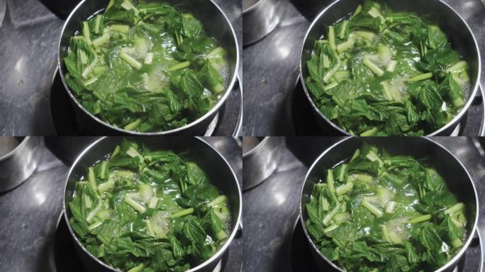 白菜蔬菜在锅里煮沸。中国蔬菜素食菜单。维生素绿色成分。