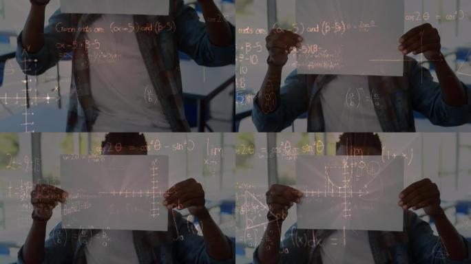 在小学拿着论文的非洲裔美国男孩身上漂浮的数学方程式