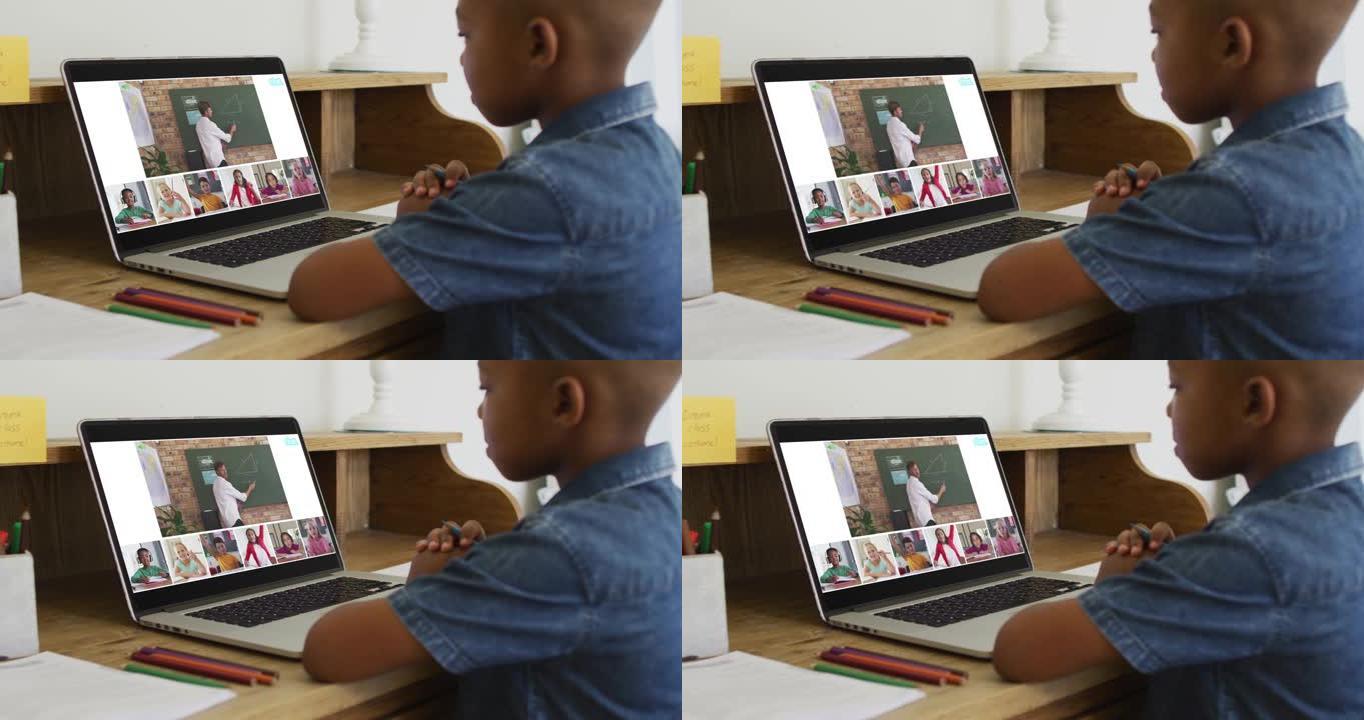 非裔美国男孩拿着铅笔在家里的笔记本电脑上进行视频会议