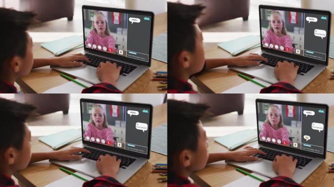 亚洲男孩在家里的笔记本电脑上与同学进行视频通话