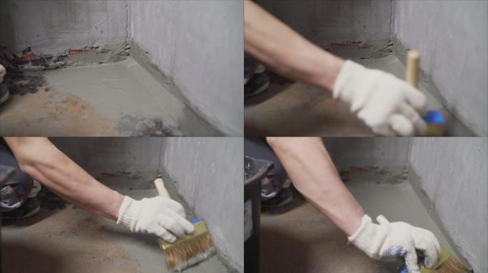 用溶液灌注地板的过程。混凝土地板防水。修复防水水泥处理系统前的开裂地板