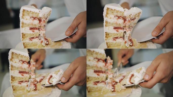 在活动中，一把刀切了一个生日蛋糕。慢动作非常酷的特写镜头