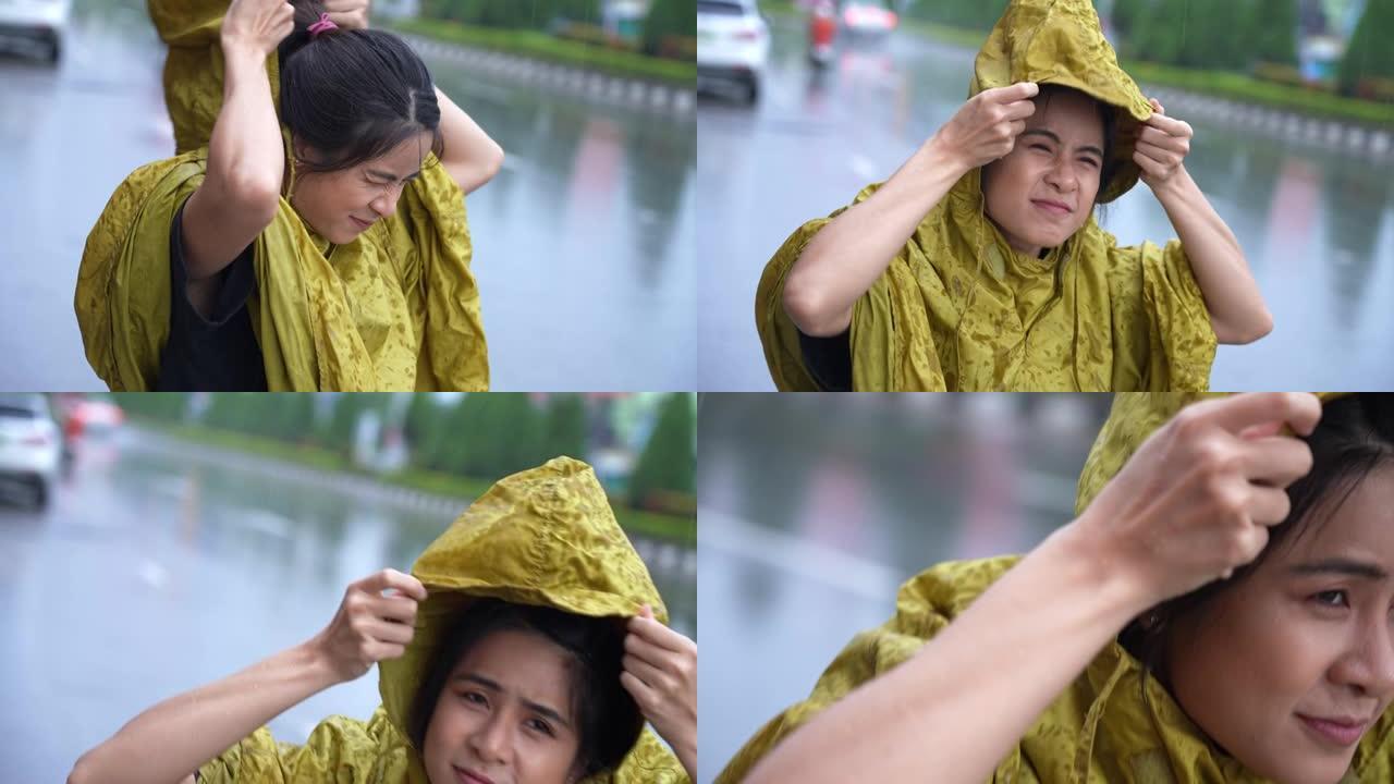 亚洲女孩穿着黄色雨衣匆忙穿上连帽衫，开始下雨，雨季天气气候倾盆大雨，外出工作时运气不好淋湿，高峰时间