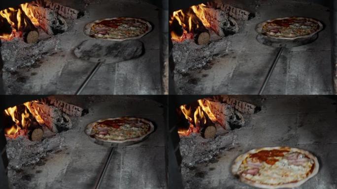 在燃木烤箱中烹饪比萨饼