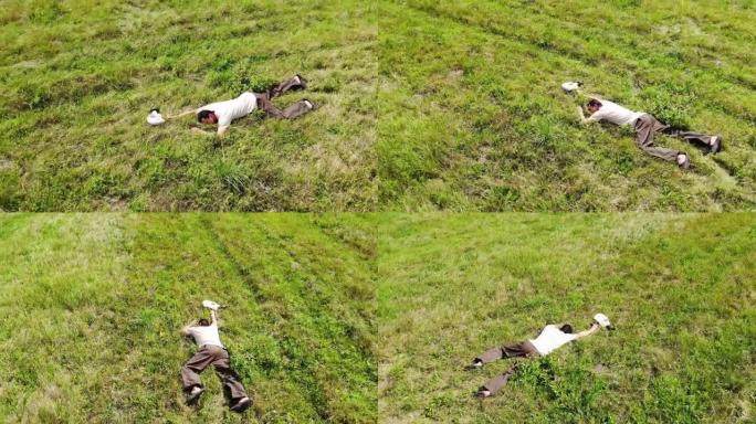 男子倒在地上，昏倒躺在绿草上，感觉不好，上气不接下气，防毒面具靠近他，空中射击概念灾难