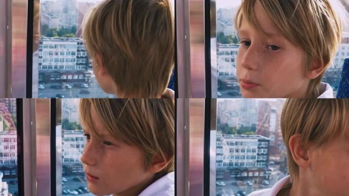 一个雀斑的金发男孩，从高处看着城市的观景台。孩子脸的特写。与儿童一起休闲活动