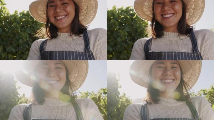 4k视频片段，一名年轻女子站在葡萄园中