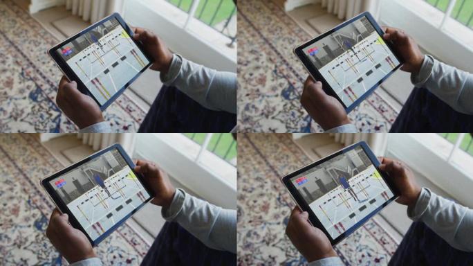 男人坐在家里，在平板电脑上观看田径比赛的合成