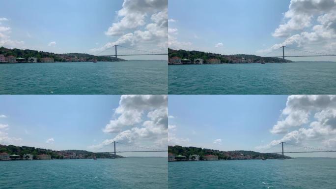 在伊斯坦布尔的高档社区 “Cengelkoy” 和大桥上拍摄的博斯普鲁斯海峡上的船只镜头。在阴天的夏