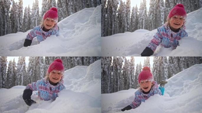 SLO MO女孩躺在雪地里，一边笑，一边向镜头扔雪