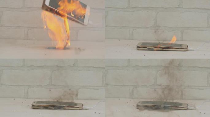 在家里或办公室的办公桌上给电池充电时，智能手机会爆炸并燃烧。房屋火灾原因的概念。