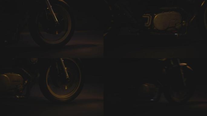 黑暗背景下摩托车前轮的精彩特写镜头
