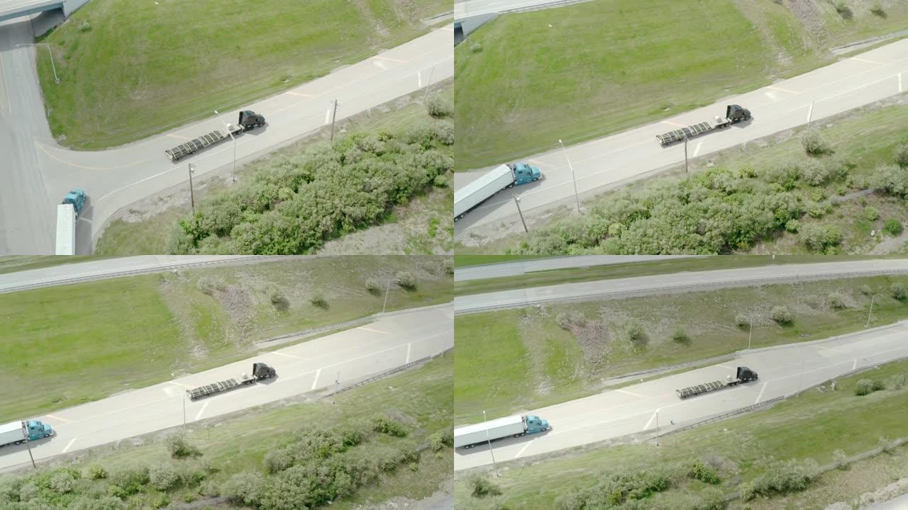卡车在转弯的道路上行驶的空中无人机视图。