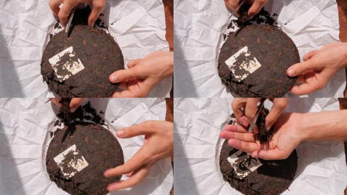 舒普饼中国发酵红茶白纸刀。男性手握碎碎压旧圆形成熟深色普洱成片健康健神饮料咖啡替代品4K