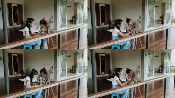 泰国年轻女子假日教妹妹画画 -- 股票视频