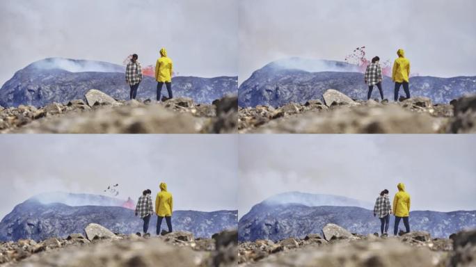 两名冒险的探险家观察到爆发火山释放岩浆的镜头
