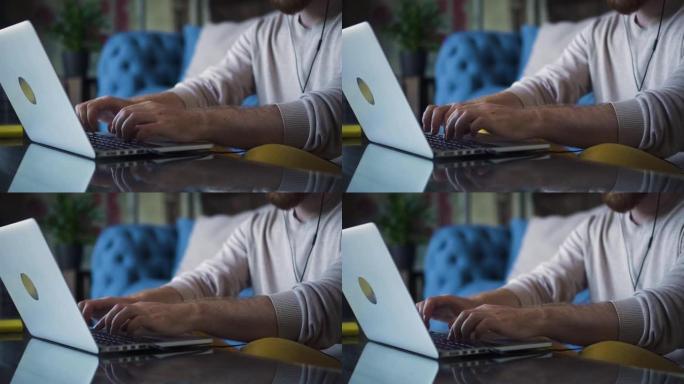 关闭在笔记本电脑键盘上打字的人的手。Spbd男性在记者文章报道中工作