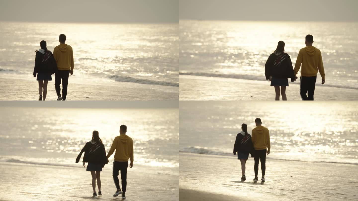 L情侣在早晨的海边漫步