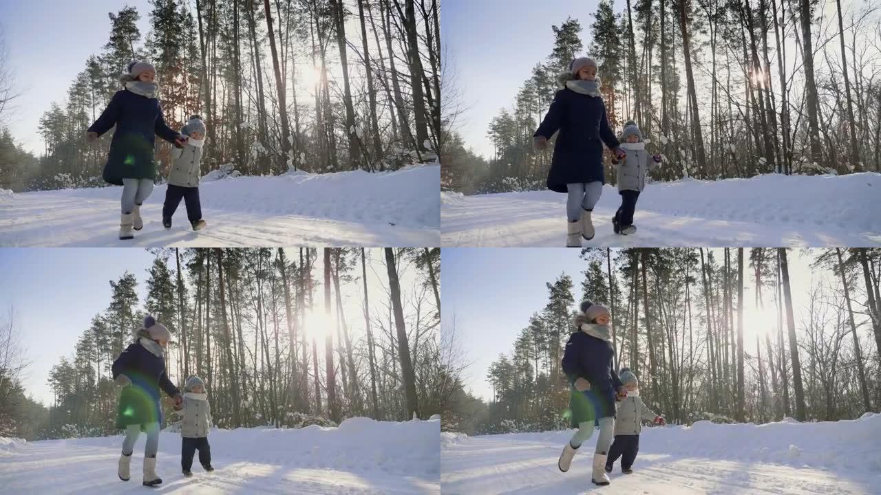 穿着暖和衣服的孩子在雪道上奔跑