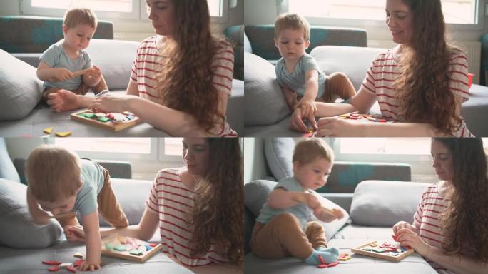 年轻的高加索单身母亲在家里和她可爱的男婴玩耍